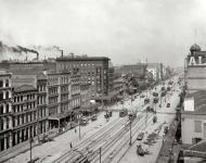 Circa  The caption for this glass negative has been misplaced -- who will be the first person to identify this city and its famous thoroughfare